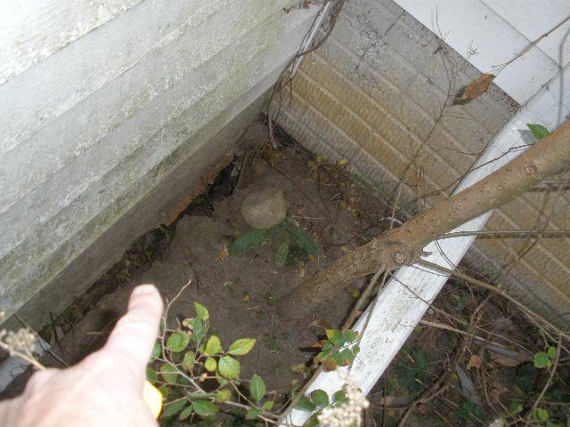 Poor slope results in the washing away of the ground around the foundation. Cedar Rapids Home Inspector